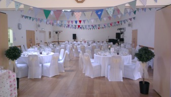 Village hall laid out for a wedding reception